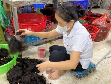 Skilled workers sorting raw Vietnamese hair