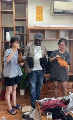 Wholesale customers checking hair quality at Lyn Hair factory